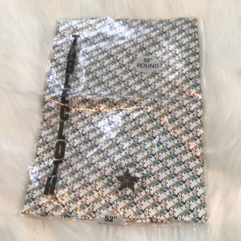 Vintage Mickey Mouse and Pluto plastic tablecloth.